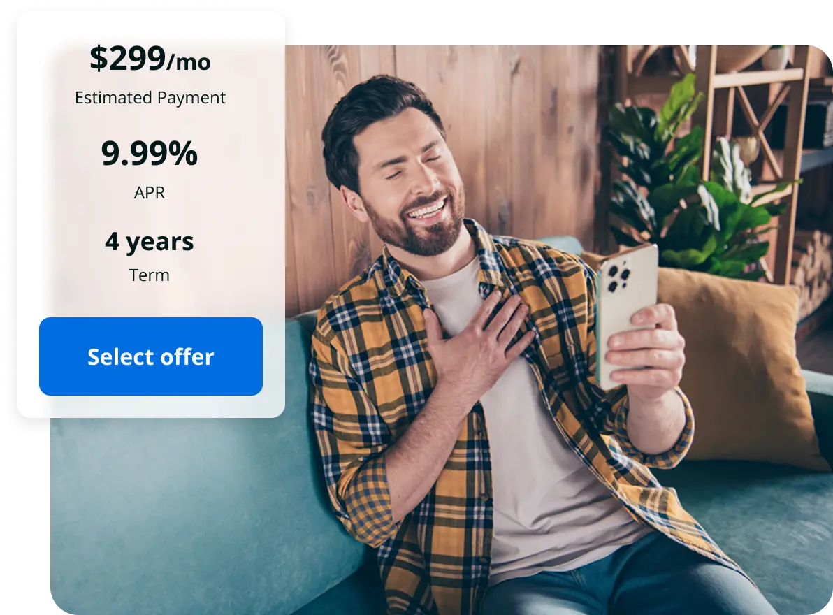 Man looking at phone very happy with the loan offers he received.